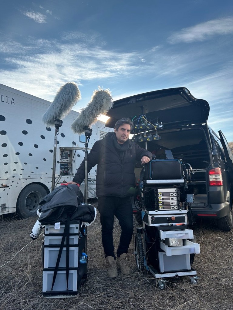 44 unit — sound recordist with full cart and twin booms on location