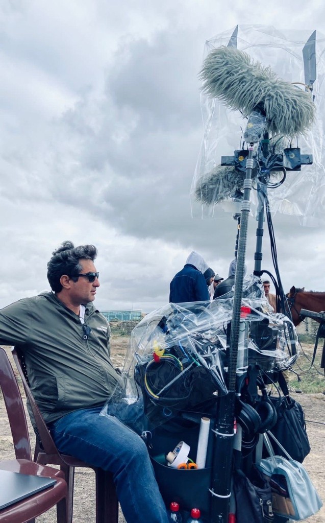 Sound cart under plastic rain cover with twin booms