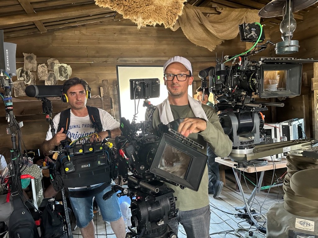 Sound bag and cinema camera inside a wooden set cabin